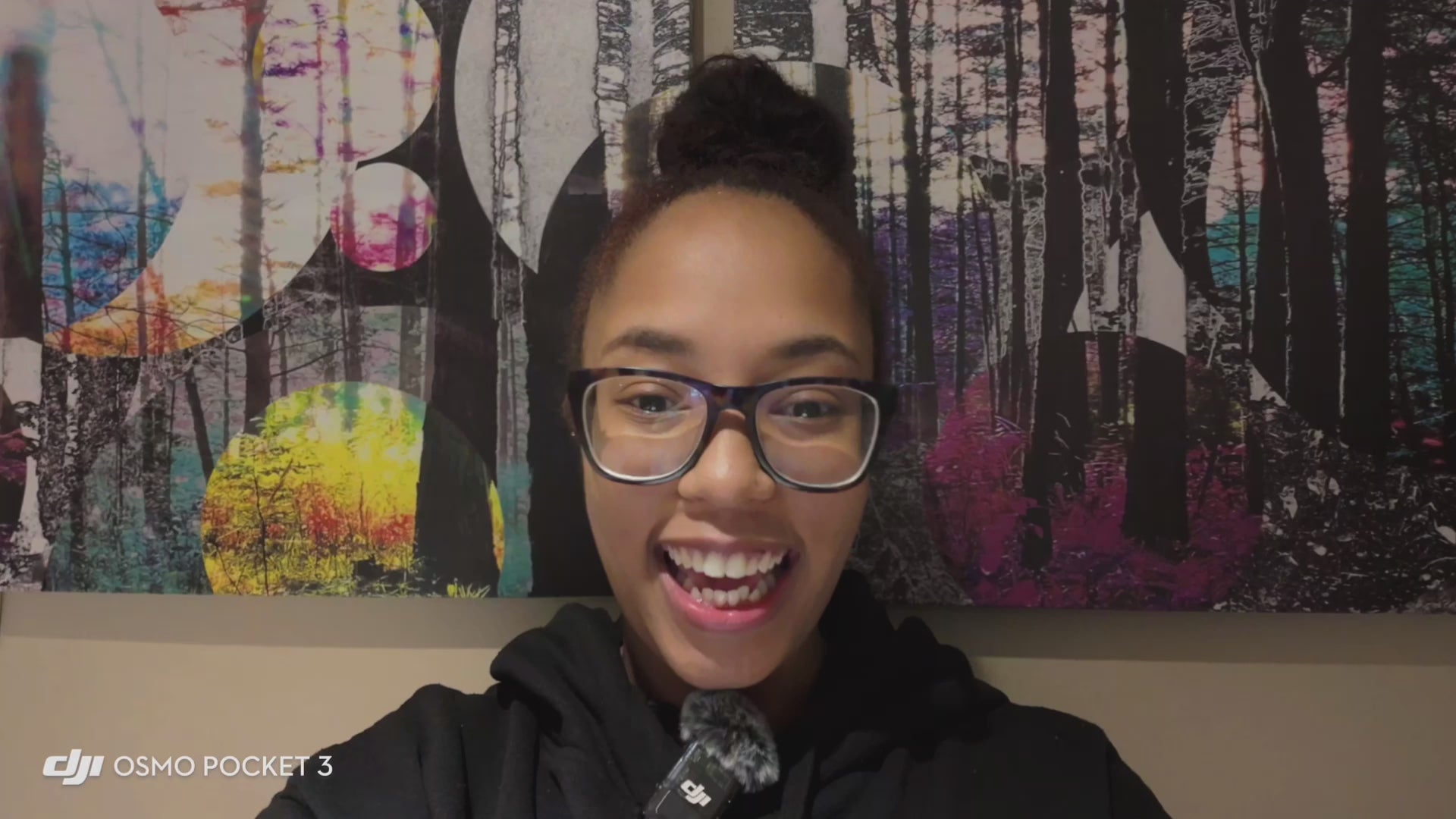 Load video: TBP Founder Kai in front of colourful poster introducing herself